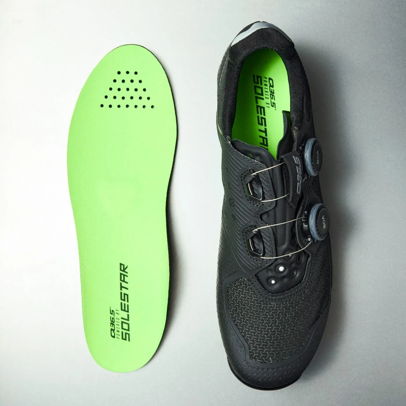 Cycling shoes with riding socks and insoles prepared for a fit check